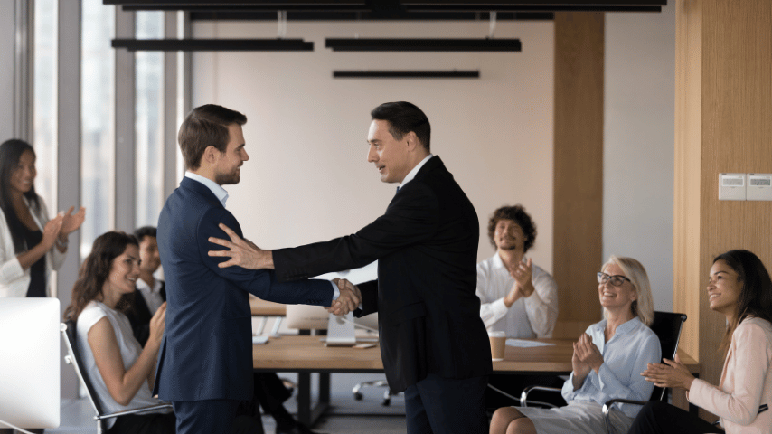 company boss congratulate promoted employee staff applauding